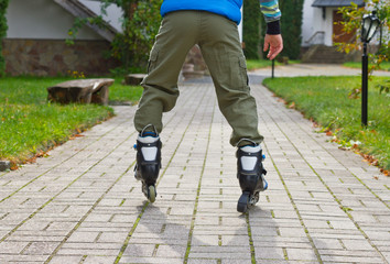 Roller skate legs close up in skatepark. Low section. Roller skates is extreme sport.