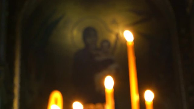Candle Lit in the Church, the Camera's Focus Gradually Transferred to the Dome. we See God's Mother and Child