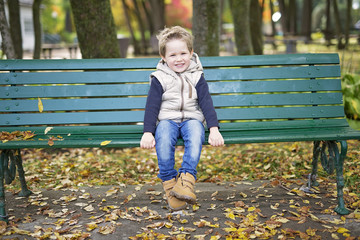 boy in autumn season in a park