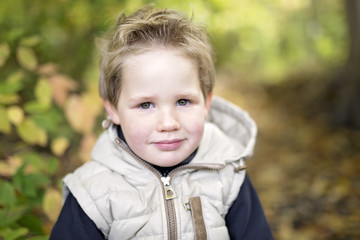 boy in autumn season in a park