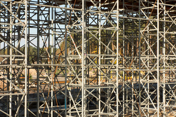 .construction scaffolding built under an overpass over the highw