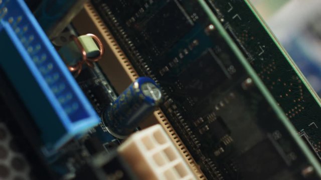 Memory slots close-up on motherboard with chipset and wired connection