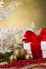 Fototapeta na wymiar Christmas balls, Gift box with red ribbon, Holiday background