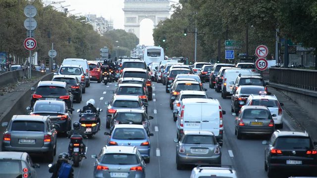 Traffic in Paris - Arc De Triomphe Du in the Background - Paris France