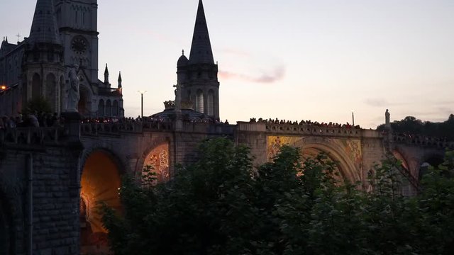This video is about Lourdes preghiera al tramonto