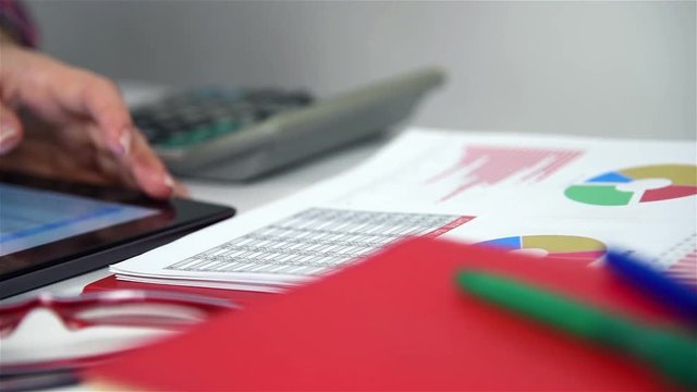 Accountant Woman Using Digital Tablet With Stock Chart Report. Cloae Up