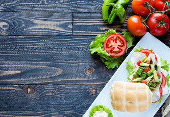 Fresh and tasty sandwich with ham and vegetables