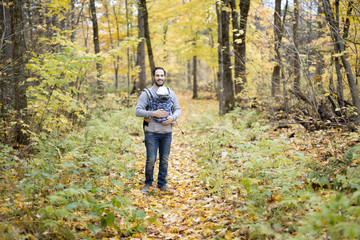 Father with daughter baby in autumn forest