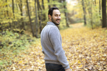 middle-aged man alone on beautiful autumn day