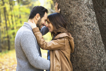 Nice couple having fun in autumn park