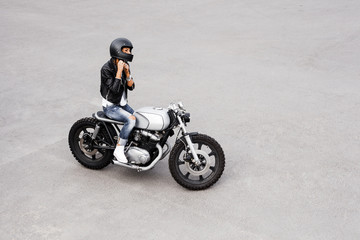 Plakat Biker woman in leather jacket on motorcycle