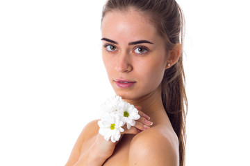 Young woman holding white flowers