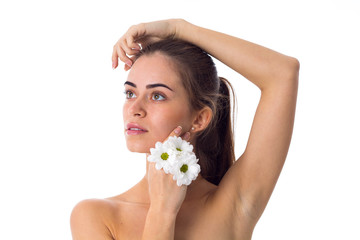 Young woman holding white flowers