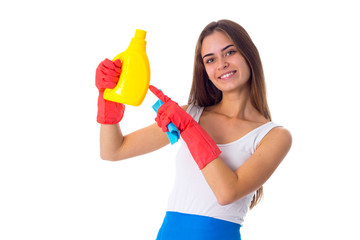 Woman holding duster and detergent 
