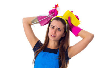 Woman holding detergent and duster 