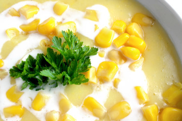 
Sweet corn soup in a white bowl

