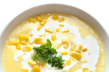 Bowl of sweet corn soup isolated on white background
