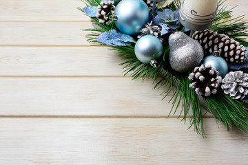Fototapeta na wymiar Christmas background with holiday decorated candleholder and blu