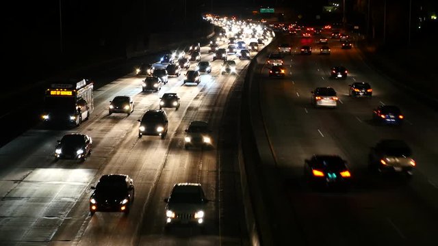  Zoom Out - Fast Traffic on the 101 Freeway in Los Angeles - Night