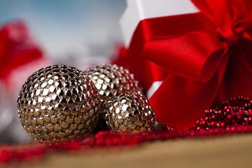 Christmas balls, Gift box with red ribbon, Holiday background
