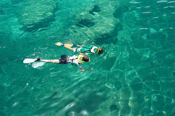 two people snorkeling