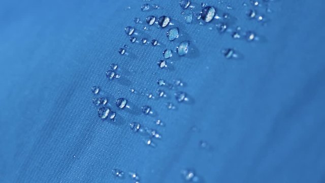 water droplets bounce off the waterproof clothes