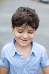 Boy smiling and looking down