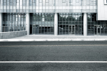 empty asphalt road near modern building in nanjing