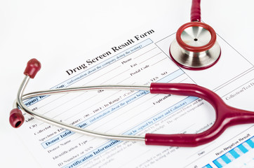 Drug test report form with Medical stethoscope.