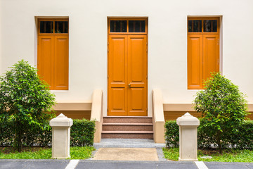 orange Door , orange window on Cream Wall on orange staircase wi