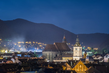 Fototapeta premium Night scape, image with Council House (city-hall) built in 15th century by saxons, and Black Church in Brasov.