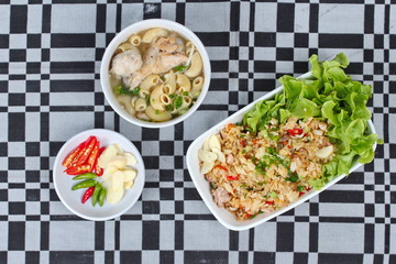 Fried garlic jasmine rice with minced pork served with side dish as Macaroni chicken soup and spicy filling