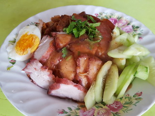 Barbecued red pork in sauce with rice,