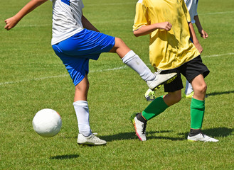 Naklejka premium Kids are playing soccer