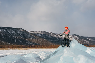 Girl on a bmx on ice.