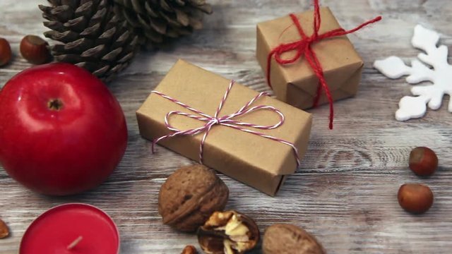 Fresh apples, nuts and gift box on wooden rustic table