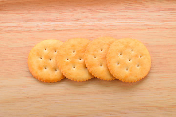 Biscuit isolated on the wooden floor.