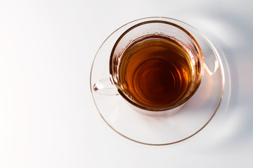 transparent glass cup with tea on