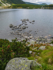 Mountain lake with stones in the water