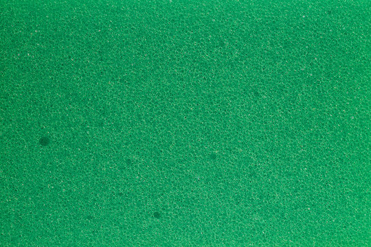 texture of green polymeric foam material, macro image..