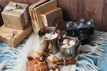 Metal mugs with cacao and marshmallows