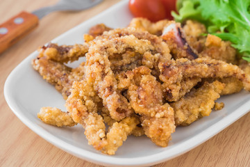 Fried tentacles squid on plate