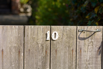 House Number 10 sign on gate