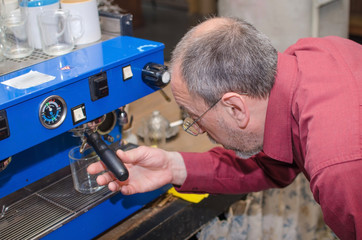 Aged man making coffee