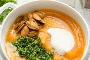 Pumpkin soup with pesto and roasted seeds