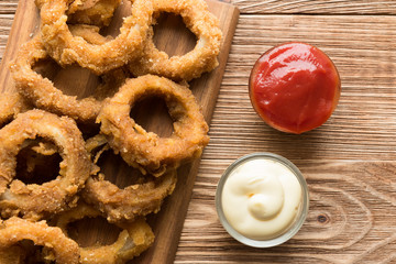 Traditional fastfood - onion rings with beer