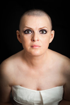 woman oncology disease on a dark background with no hair