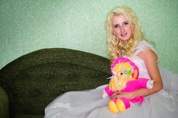 Abstract bride on the couch and looking at the camera