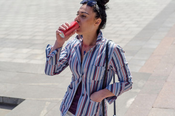 girl drinks coca cola 