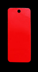 Ripped in red paper on black background.